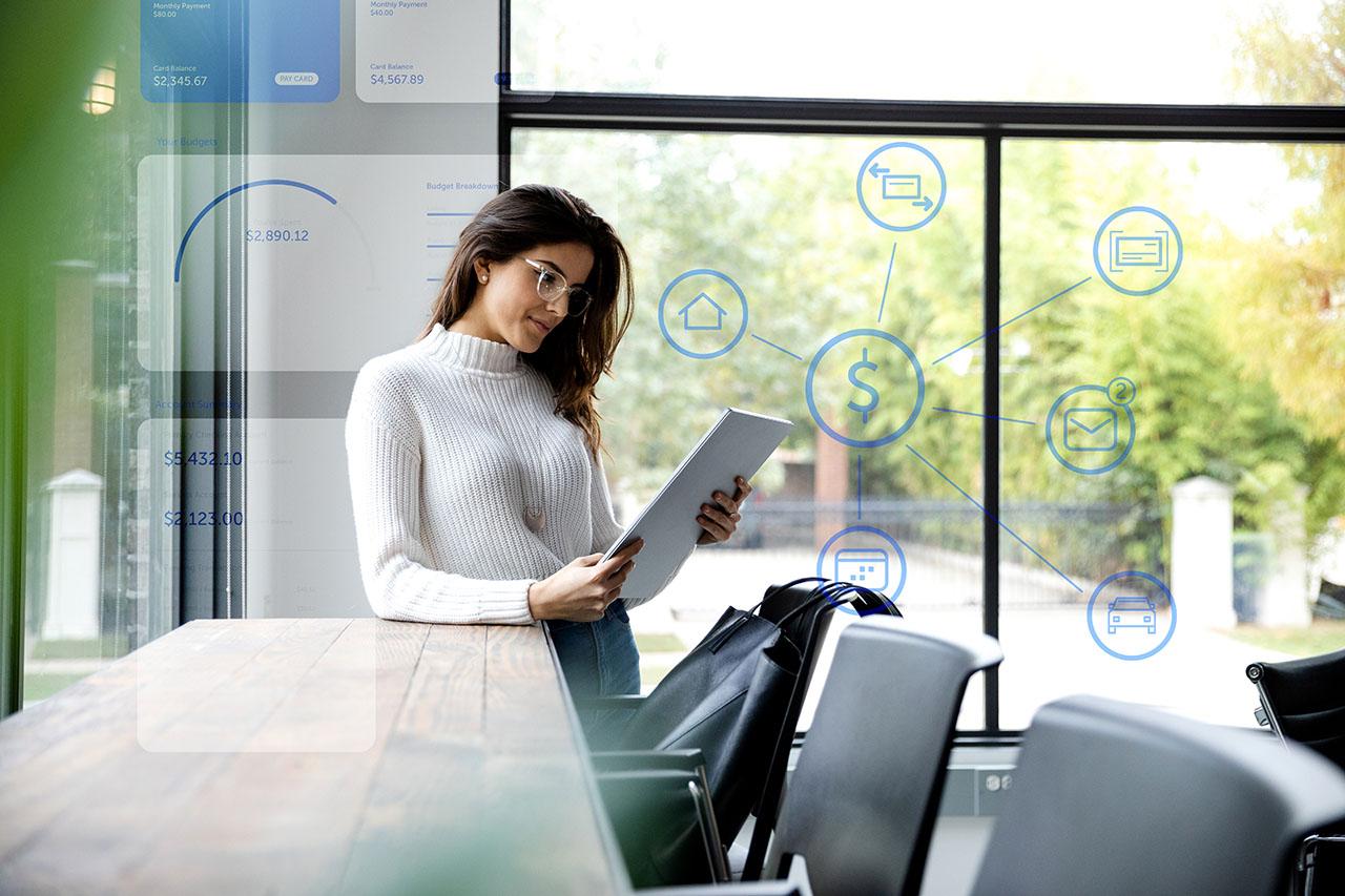 Woman holding tablet checking app